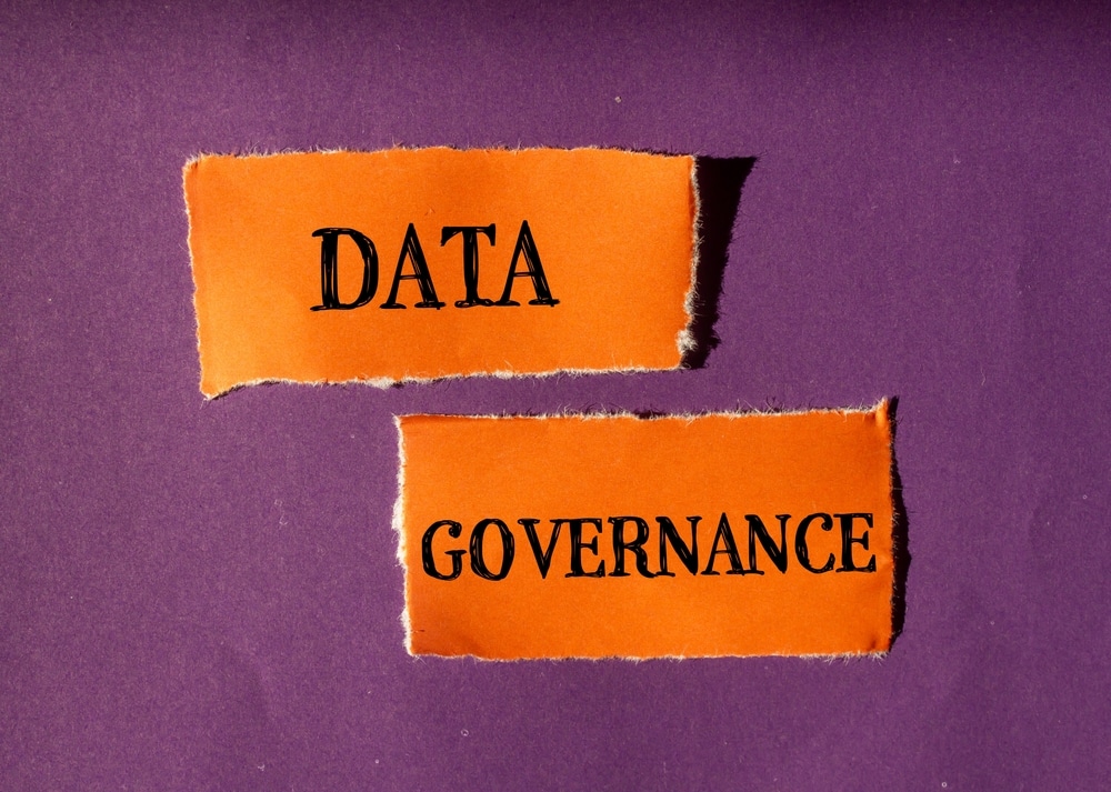 Data,Governance,Words,Written,On,Ripped,Orange,Paper,Pieces,With