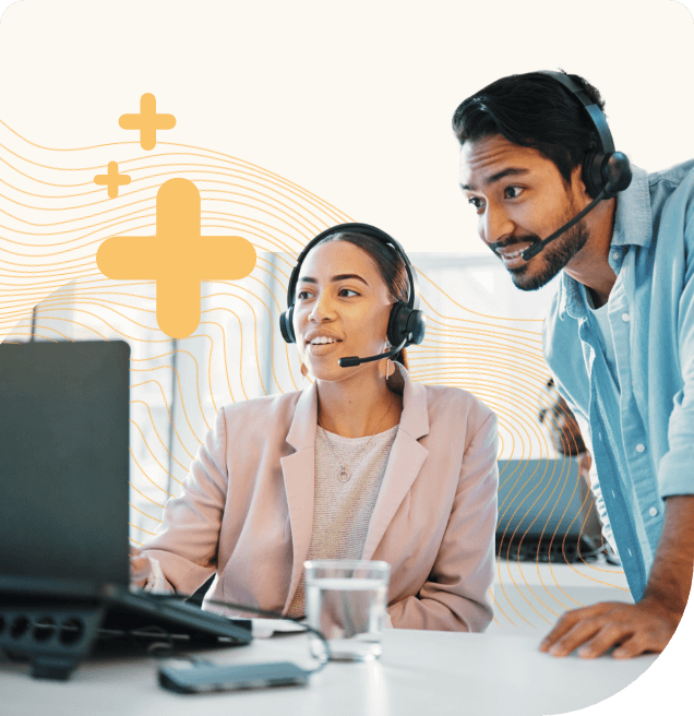 two telecom agents looking at a computer screen